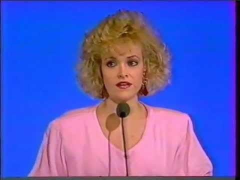Rebeca Arthur on Hollywood Squares American game show with a blonde curly hair while wearing a pink blouse