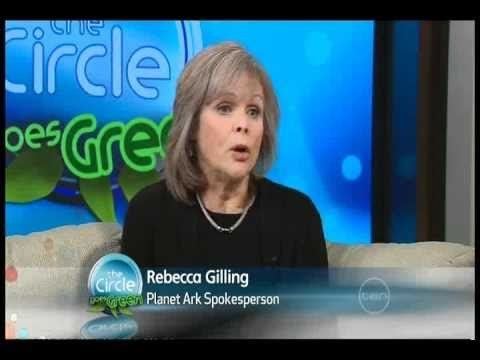 Rebecca Gilling while talking during an interview, with short blonde hair, wearing a necklace and a black dress.