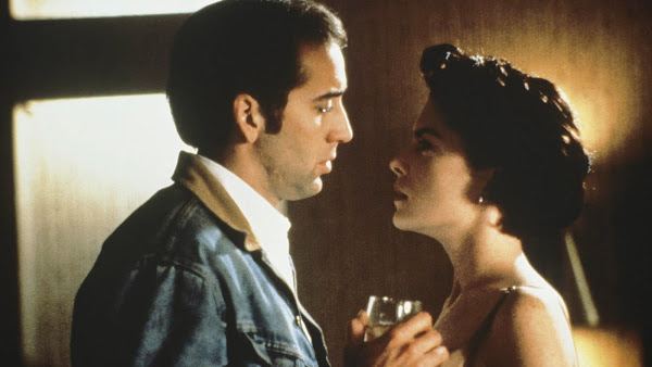 Red Rock West movie scenes Michael Nicolas Cage gets himself into hot water with Wayne s wife Suzanne Lara Flynn Boyle in Red Rock West