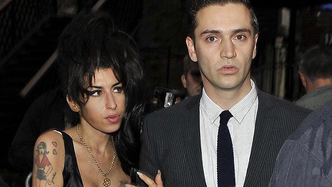 Reg Traviss Amy Winehouse39s boyfriend Reg Traviss charged with two