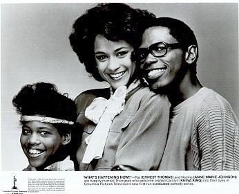 Poster of "What's Happening Now!", an American sitcom starring Reina King, Anne Marie Johnson, and Ernest Thomas (from left to right). Reina is wearing a cloth headband, Anne is wearing a  blouse with white ribbon and Ernest is wearing a long sleeve shirt.