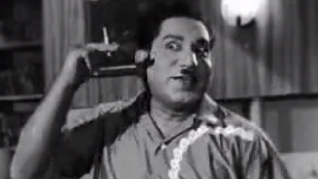 A black and white photo of Relangi Venkata Ramaiah with a funny face.