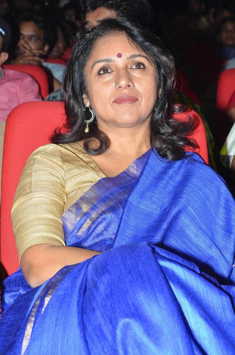 Revathi Revathi in a movie theater wearing blue and golden dress