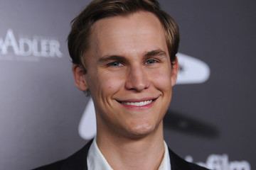 Rhys Wakefield smiling with his black hair in the Australians Film's 2011 Breakthrough Awards, wearing a white polo long sleeve under a black coat