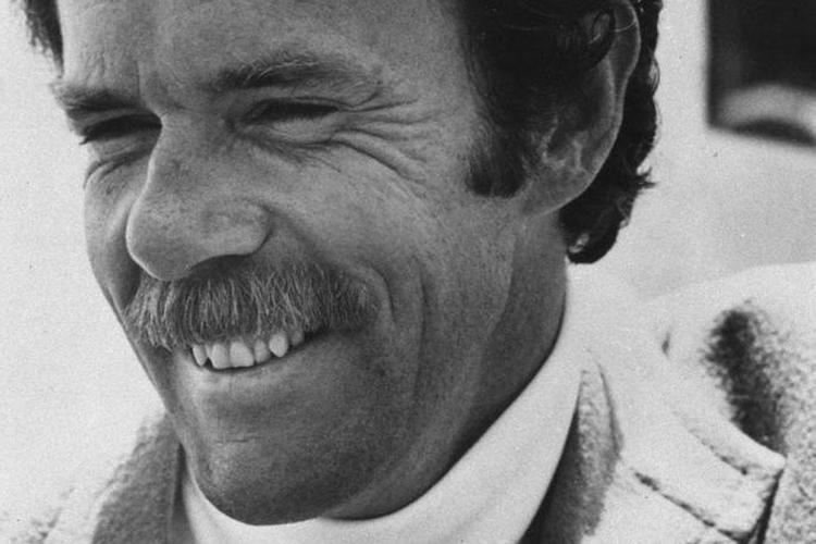 Richard Bach with a smiling face and a mustache.