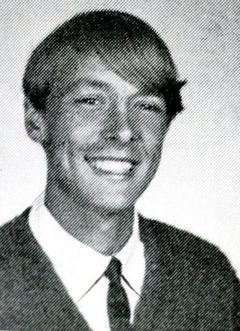 Richard Chase wearing long sleeves, neck tie and vest