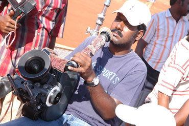 Richard M. Nathan Shooting Angadi Theru from his shoulders Rediffcom Movies