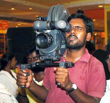 Richard M. Nathan Shooting Angadi Theru from his shoulders Rediffcom Movies