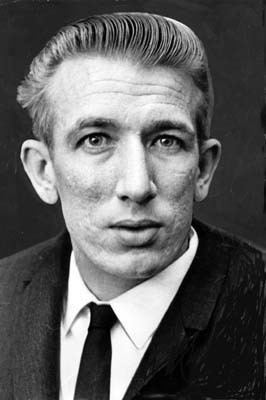 Richard Speck wearing a black coat, long sleeves, and necktie