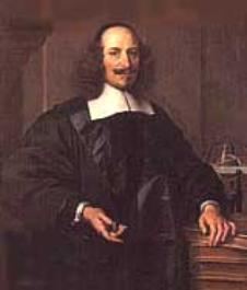 In a room with brown walls, Rigobert Bonne is serious, standing with his left hand resting on the books, with his right hand holding a pipe, has bald top and long brown side hair and a mustache wearing an black scholar's robe with white collar.