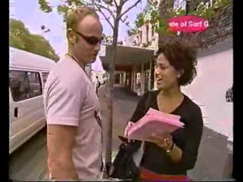 Cara talking to the man while wearing a black blouse in episode 7 of Road Rules: South Pacific