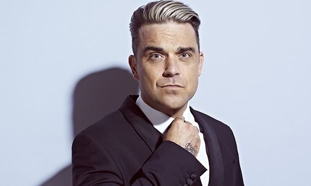 Robbie Williams Robbie Williams unveils surprise new album Music The