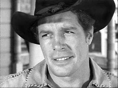 Robert Horton smiling while looking afar, wearing a shirt and a hat