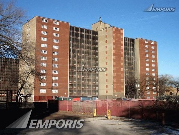 The front of Rockwell Gardens is surrounded by a tarpaulin construction fence