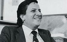 Rodrigo Lara smiling and wearing coat, long sleeves and neck tie