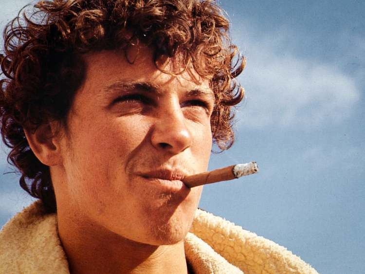 Rolf Aurness while smoking cigarette