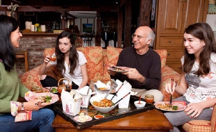 Romy David eating happily together with her father Larry David, mom and sister