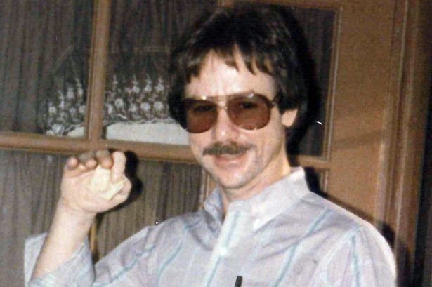 Ronald Dickson Woodroof with a mustache, wearing sunglasses and stripe long sleeves.