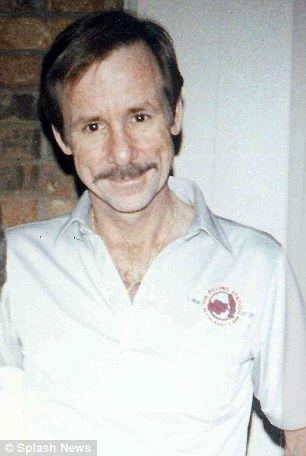 Ronald Dickson Woodroof with mustache and wearing a polo shirt.