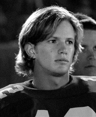 Kip Pardue as Ronnie Bass wearing a football jersey in a movie scene from the 2000 film Remember the Titans