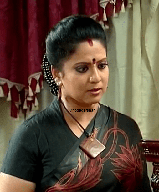 Roopa Sree wearing a black shirt and a necklace