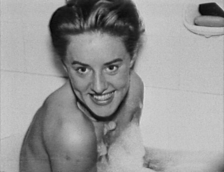 Rosemarie Nitribitt's gorgeous smile while she is in the bathtub