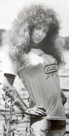 Ruby Starr with curly hair and wearing a wet shirt.
