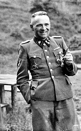 Rudolf Höss wearing his uniform as a Lieutenant Colonel while smiling