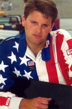 Russell Phillips wearing jacket inspired by American flag