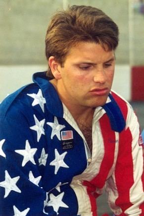 Russell Phillips wearing jacket inspired by American flag