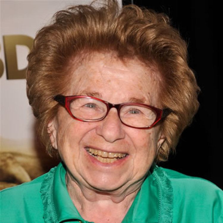 Ruth Westheimer in her beautiful smile, eyeglasses and green blouse
