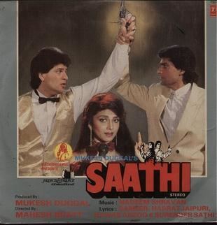 The poster of the movie SAATHI 1991, has gray background, On the left Aditya Pancholi is serious, mouth half open, standing with his left hand holding a gun up with a yellow round spotlight at the back, looking to his left has black hair wearing a white long sleeve polo with black bowtie under a gold vest, in the middle Varsha Usgaonkar is serious, holding a black mic, has red hair, wearing a long earring  and red dress, at the right Mohsin Khan is serious looking to his right, holding Aditya’s hand, has black hair wearing a white polo under a cream coat, at the bottom is a word “MUKESH DUGGAL’S” with Aditya Pacholo standing(left) back to back with Moshin Khan(right), from left Aditya standing with his hand holding a gun up, facing his right, has black hair wearing a black jacket, at the right Moshin Khan with his hand holding a gun up has black hair wearing a white jacket below is the title “SAATHI” and the Produced Bv : MUKESH DUGGALDirected By :MAHESH BHATTMusic : NADEEM SHRAVANLyrics :SAMEER, HASRA JAUPURI, NAWAB ARZOO & SURENDER SATHI,