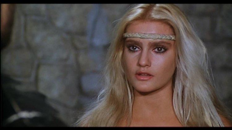 Sabrina Siani as Princess Valkari with a serious face, blonde hair, and wearing a band on her forehead in a movie scene from The Throne of Fire, a 1983 Italian film.