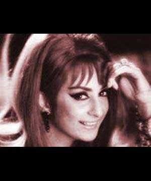 Saira Banu smiling and hand on her forehead