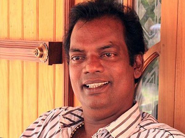 Salim Kumar wearing white and brown stripe long sleeves