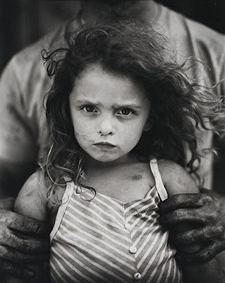 A black and white portrait of Sally Mann in 1989 called Holding Virginia.