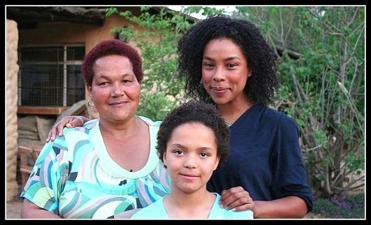 Sandra Laing smiling with Sophie Okonedo and Ella Ramangwane