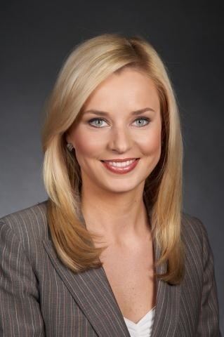 Sandra Smith wearing a brown coat