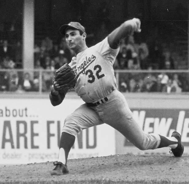 Sandy Koufax with his arm in the ice bath.