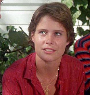 Sarah Holcomb wearing a red top in one of her scenes in Caddyshack