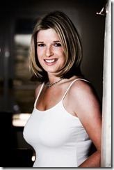 Sarah Stirk smiling while wearing a white top