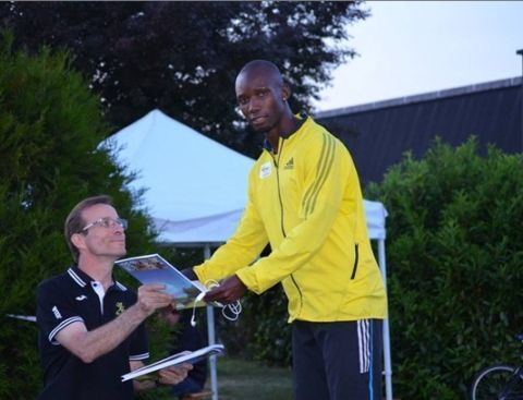 Saviour Kombe ZAMBIAS Saviour Kombe helps his team to win the 4400 metres relay