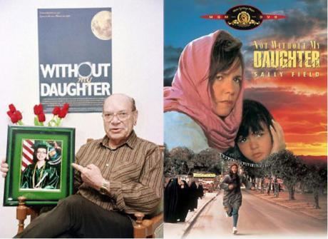 On the left, Sayed Bozorg Mahmoody wearing eyeglasses and brown striped long sleeves while pointing to a picture frame of his daughter. On the right, a poster of "Not Without My Daughter", a 1991 American drama film starring Sally Field as Betty Mahmoody, Alfred Molina as Sayyed Bozorg "Moody" Mahmoody, and Sheila Rosenthal as Mahtob Mahmoody.