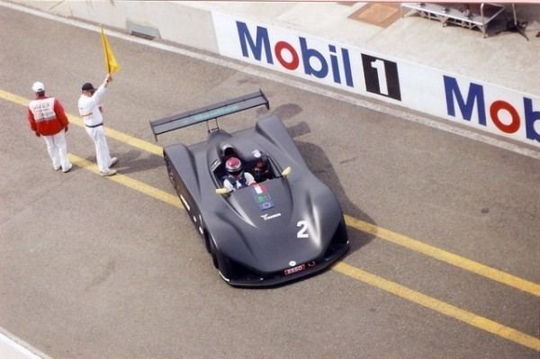 Sébastien Enjolras riding a black racing car getting ready for the race.