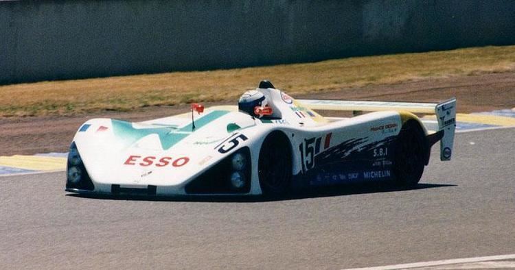 Sébastien Enjolras riding a racing vehicle during a race.