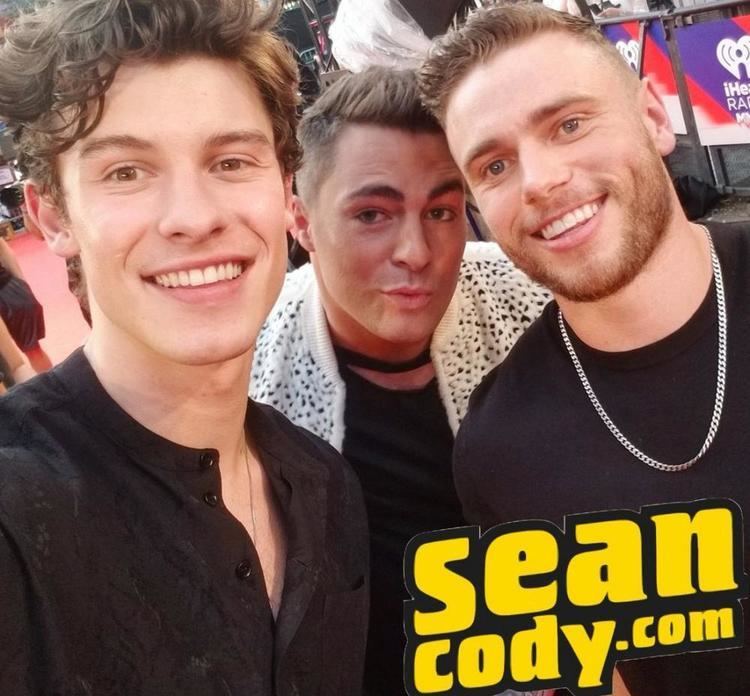 Shawn Mendes, Colton Haynes, and Gus Kenworthy are all wearing black shirts.