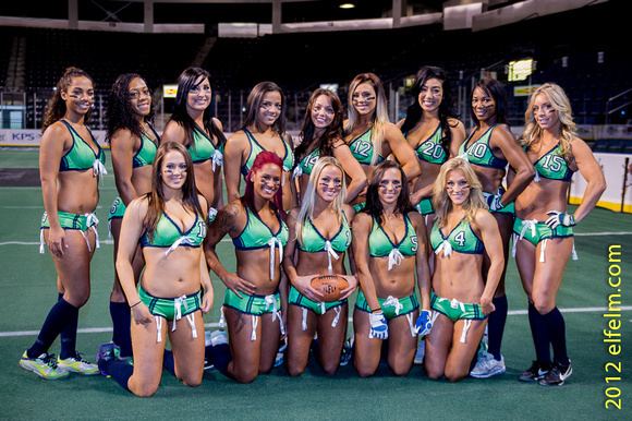 Seattle Mist players smiling together while wearing their green uniform