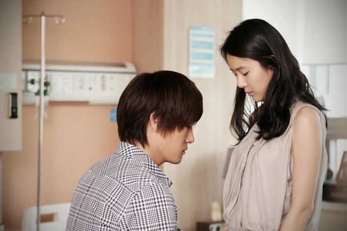 Yoo Ji-tae and Yoon Jin-seo inside a hospital in a movie scene from Secret Love (2010 film)