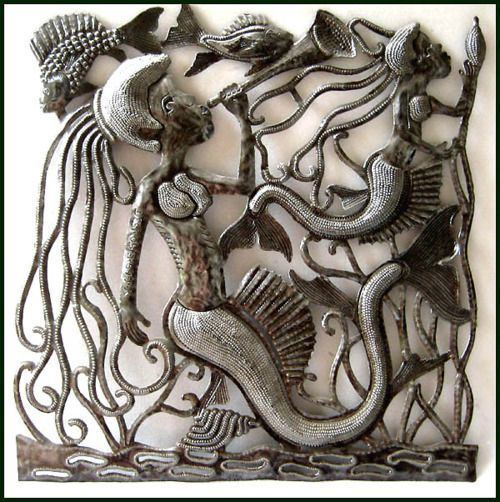 Serge Jolimeau Mermaids sculpted from steel drums by Haitian artist Serge Jolimeau