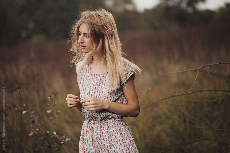 Sergey Filimonov Portrait of young female walking in autumn field by Sergey Filimonov